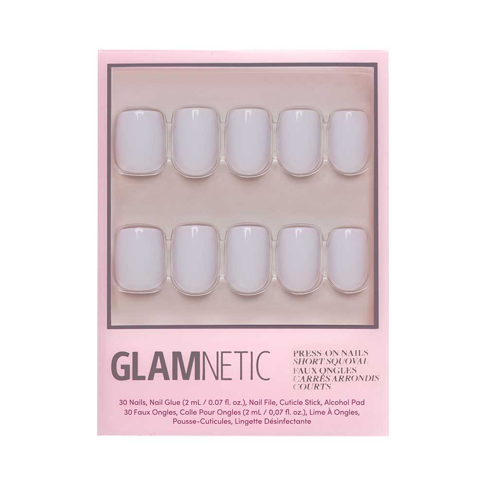 A package of glamnetic Lilac Gray press-on nails with 20 short, rounded squoval nails in pale pink, glossy finish. Includes nail glue, cuticle stick, alcohol pad & disinfectant wipe—all in a chic pink box. - Product image