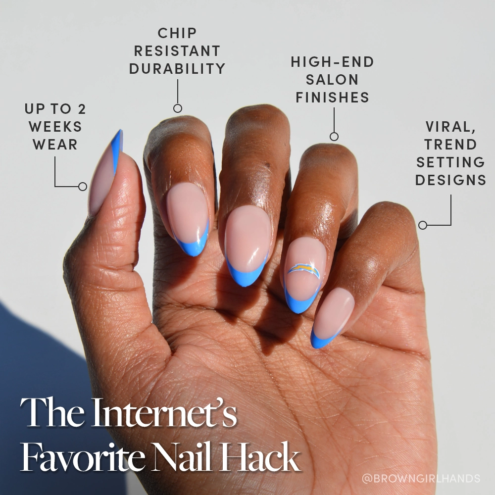 A hand with almond-shaped nails features a blue French tip manicure using the glamnetic Los Angeles Chargers Press-On Nail Set. Labels highlight up to 2 weeks’ wear, chip-resistant durability, salon-quality finish, and trend-setting designs. “The Internet’s Favorite Nail Hack.”. - Product image