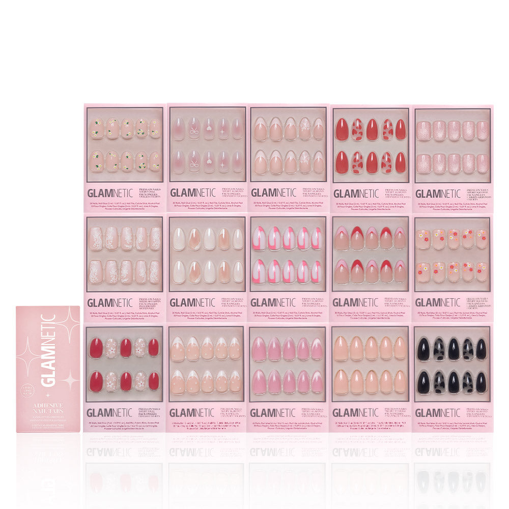 The Love In Bloom Collection by glamnetic features sixteen press-on nail sets in pink packaging, with various designs arranged neatly in a four-by-four grid on a white background. - Product image