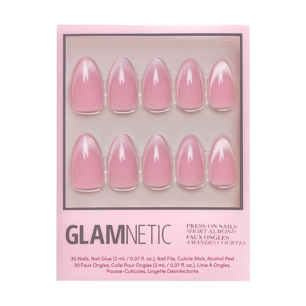 A box of glamnetic Lovers Blush press-on almond nails in a short, glossy, blush-toned style. Includes 10 velvet-finish pale pink nails arranged in two rows inside chic pink packaging with the brand name displayed.