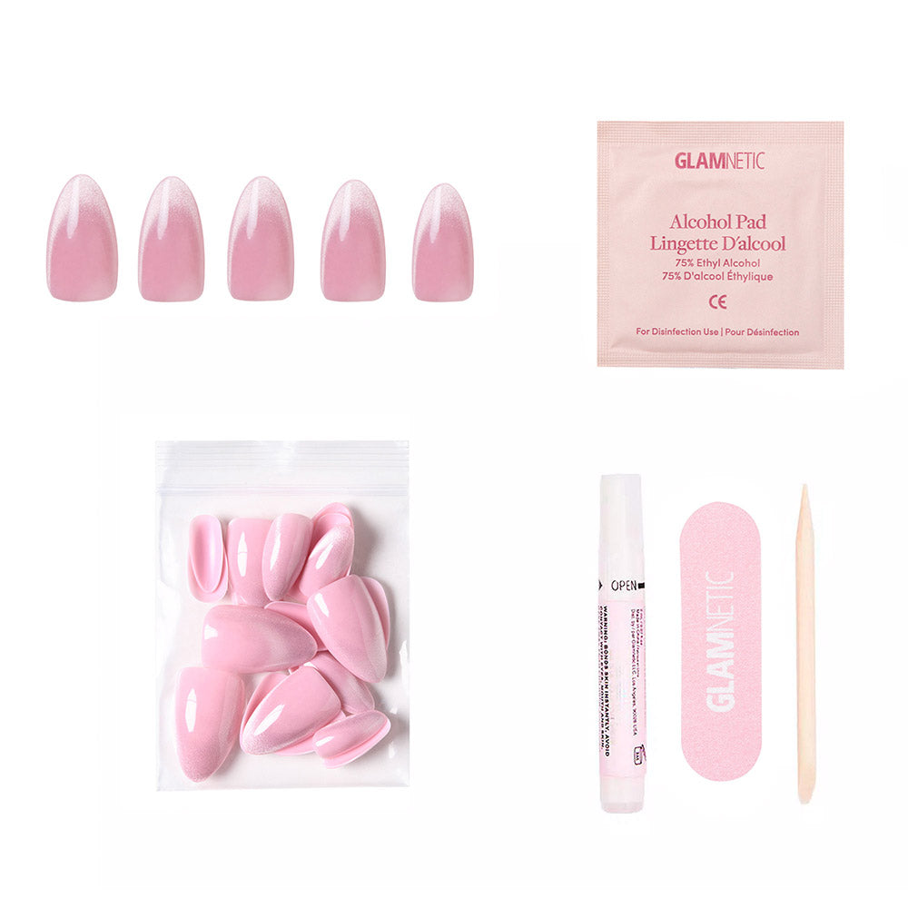 The glamnetic Lovers Blush press-on nail kit includes blush-toned almond nails, an alcohol pad, extra nails, nail glue, a pink nail file, and a wooden cuticle stick—all arranged on a white background. - Product image