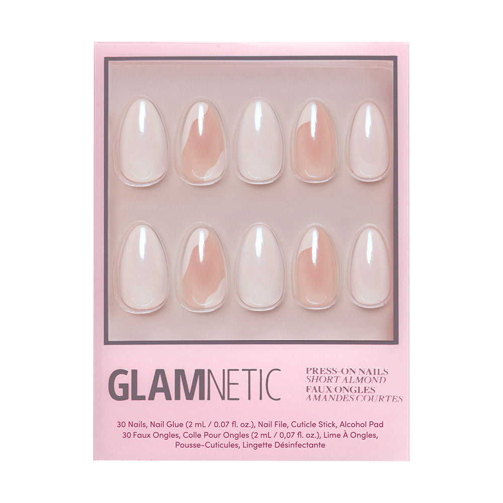 A box of glamnetic Lovey Dovey short almond nails in a minimalist nude, glazed finish. The set of 10 comes in a pink box with product details displayed at the bottom.