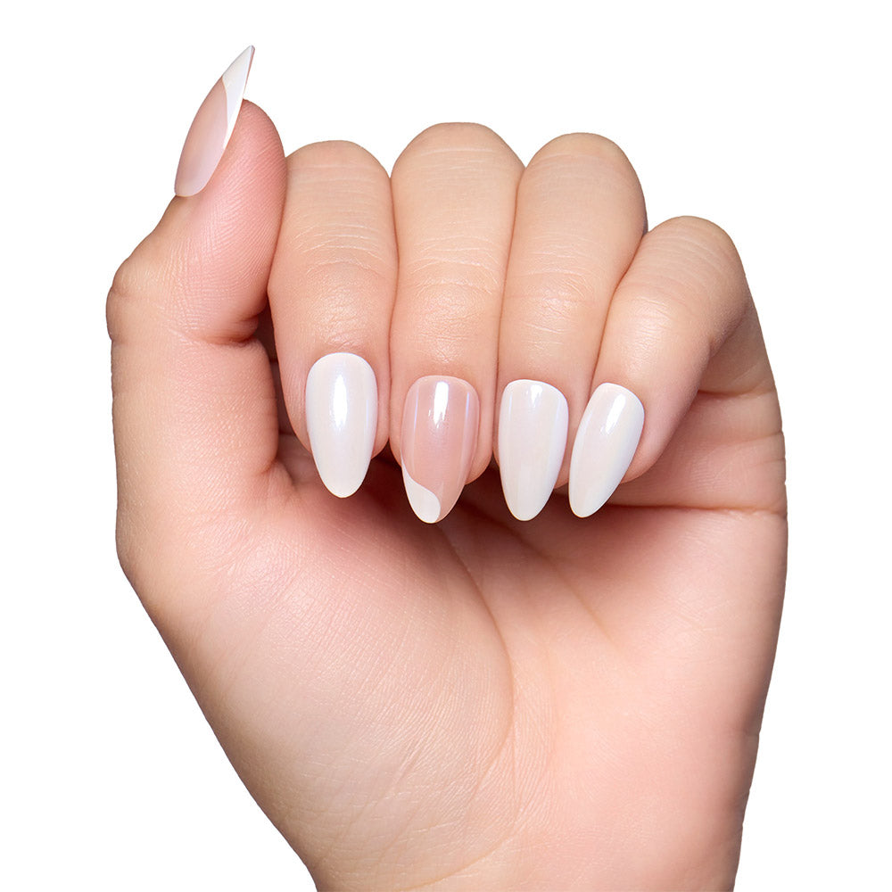 A hand with long, almond nails features glamnetics Lovey Dovey press-ons in a glossy pale pink and white ombre minimalist design, set against a white background. - Product image