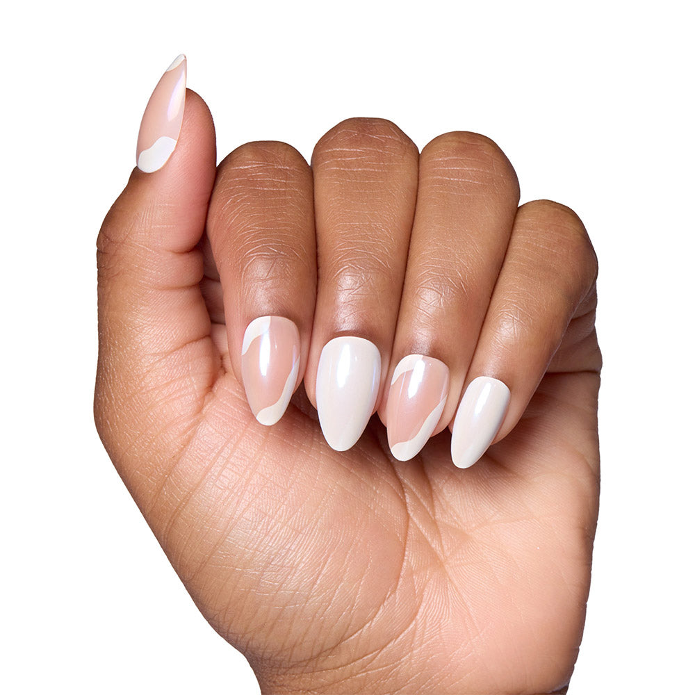 The Lovey Dovey by glamnetic features almond nails with a modern white French tip minimalist design on a clear base, displayed against a white background. - Product image