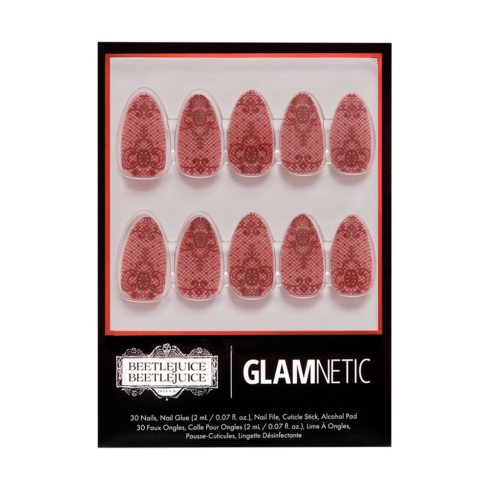 A package of glamnetic press-on nails, style Lydia, featuring 3D-raised red lace with 10 visible nails in two rows on a white background inside black and red packaging.