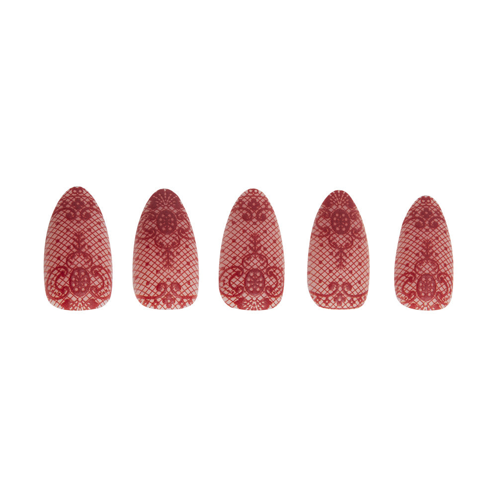 Five artificial nails from glamnetic’s Lydia set are arranged in a row, each with 3D red lace floral designs on a transparent base. The detailed Beetlejuice-inspired patterns show subtle size variations reflecting Lydia Deetz’s style. - Product image