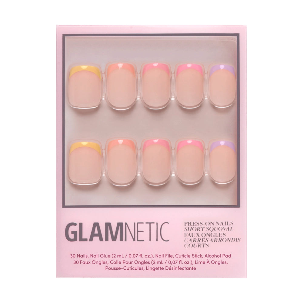 A box of glamnetic Macarons Press-On Nails includes 10 short, square nails with pastel French tips in yellow, pink, orange, and purple. The pink packaging displays product details at the bottom. - Product image