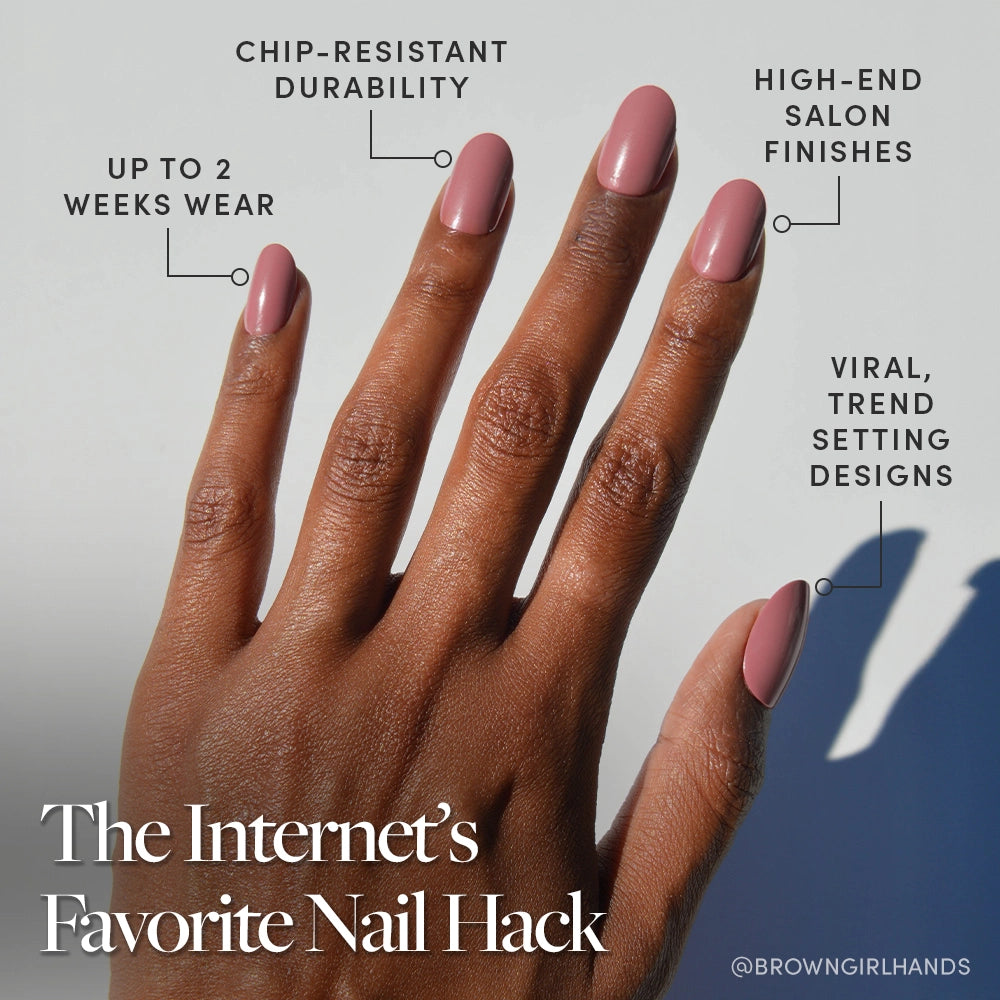 A hand with medium brown skin shows pink vegan, cruelty-free Mauve Mood nails by glamnetic. Labels highlight chip-resistant durability, up to 2 weeks' wear, salon-quality finish, and viral trendy designs. Text: The Internet’s Favorite Nail Hack. - Product image
