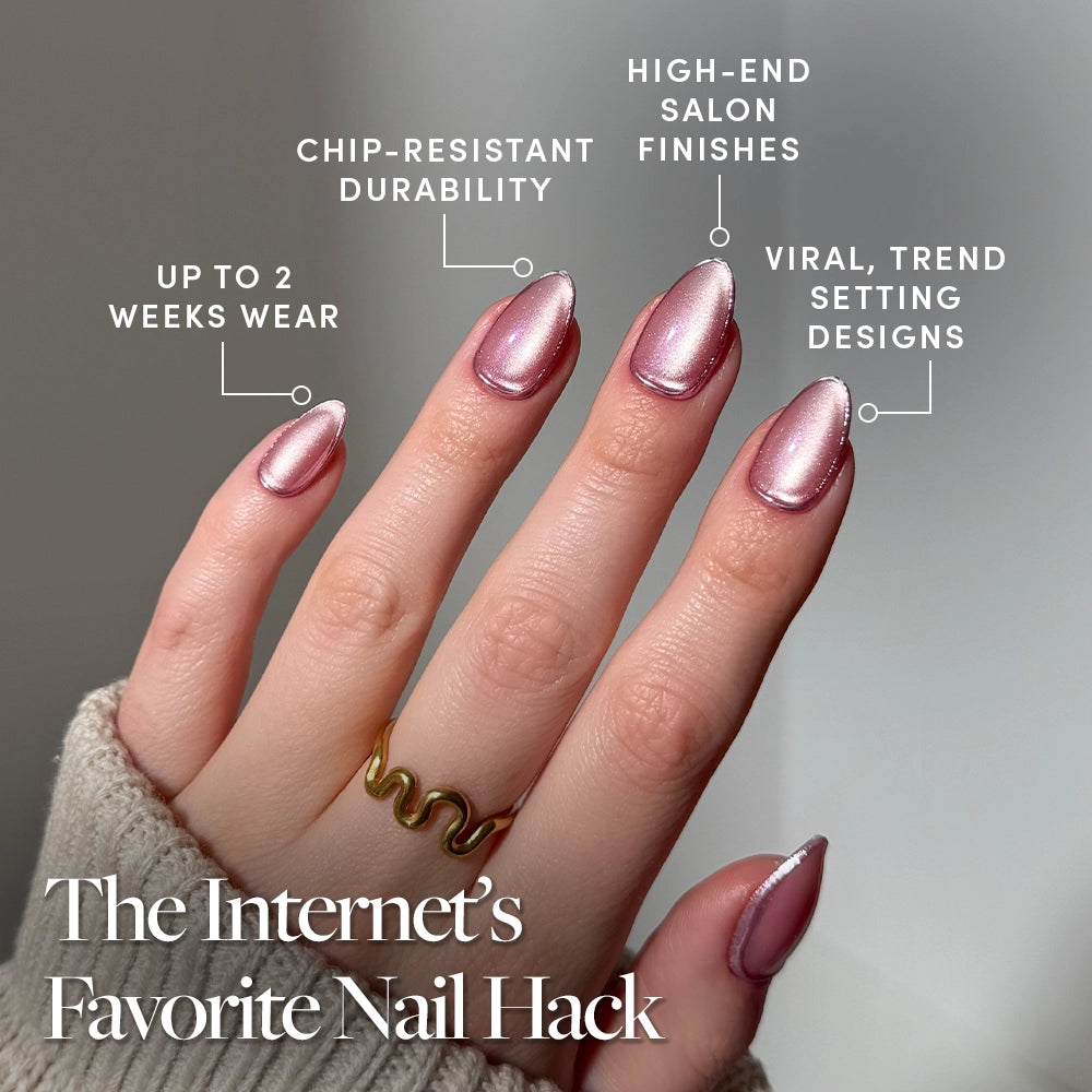 A hand with shiny pink almond-shaped Mertini nails by glamnetic is shown, each nail featuring a silver tip and subtle foil accents. Text highlights up to 2 weeks wear, chip-resistant durability, salon-quality finish, and trending designs. - Product image
