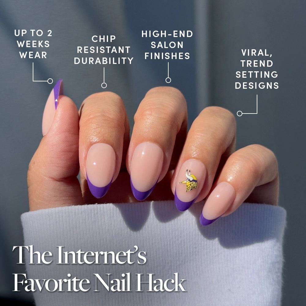 Show off trendy style and durability with the glamnetic Minnesota Vikings Press-On Nail Set, featuring long almond-shaped nails with a nude base, purple French tips, and a gold-accented accent nail for a salon finish and long-lasting wear. - Product image