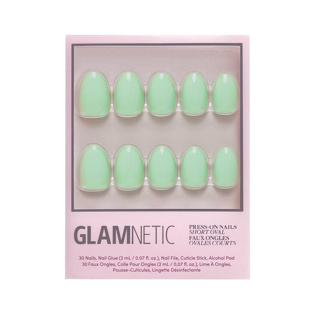 A box of glamnetic Mint Green press-on nails in a short oval shape with a glossy mint finish. Includes 30 nails, nail glue, file, cuticle stick, and alcohol pad. - Product image