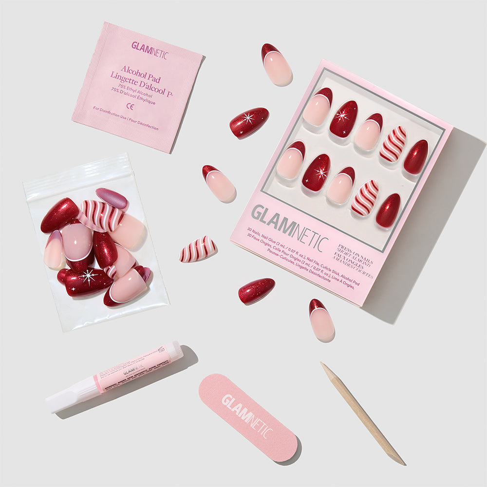 Mint to Be short almond-shaped press-on nails featuring red, pink, and white designs, including solid colors, red French tips, and candy cane stripes, with an alcohol pad, nail glue, file, and cuticle stick. - Product image