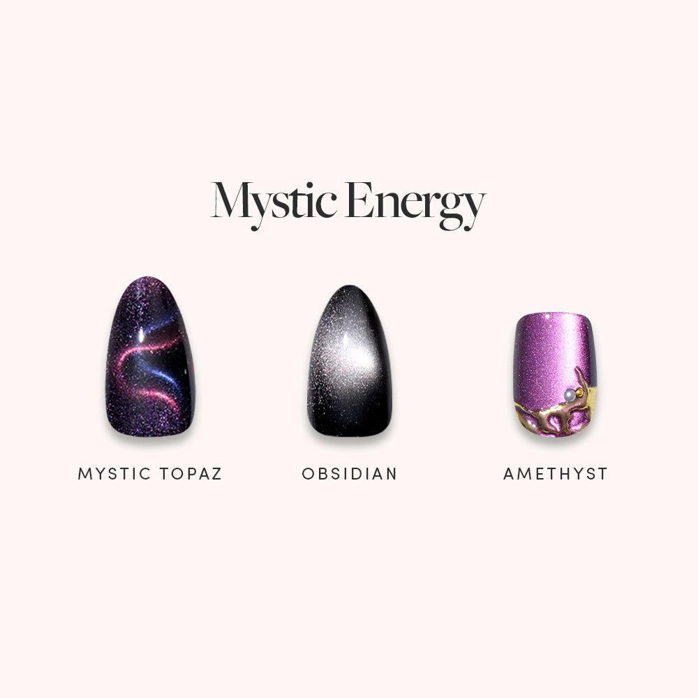 The glamnetic Mystic Energy set features three jewel-toned press-on nails: Mystic Topaz with swirling colors, glossy black Obsidian, and Amethyst in metallic purple with a gold accent. Text reads "Mystic Energy.