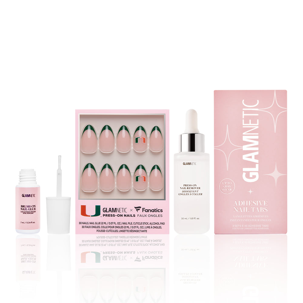The Miami Hurricanes Gameplan by glamnetic features nude and green-tipped press-on nails, nail glue with brush, cuticle oil dropper, and a pink GLAMNETIC Adhesive Nail Tabs box—all displayed on a white background.