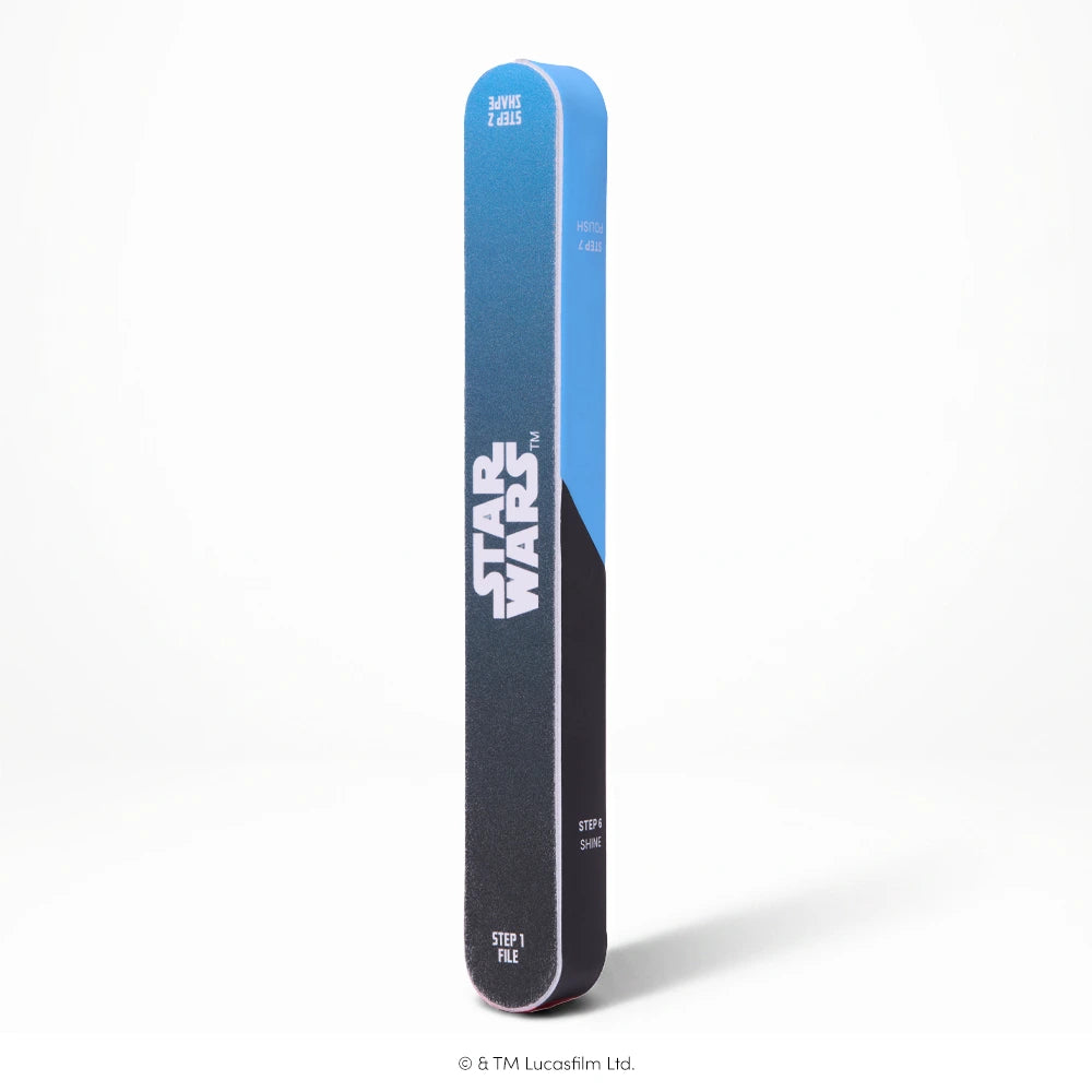 STAR WARS™ | Glamnetic 7-in-1 Nail Buffer - The glamnetic STAR WARS™ | Glamnetic 7-in-1 Nail Buffer is a rectangular nail tool featuring a striking black and blue gradient design and a bold Star Wars logo, shown standing upright against a white background—ideal for fans seeking style and versatility in their nail care or press-on manicure routine.