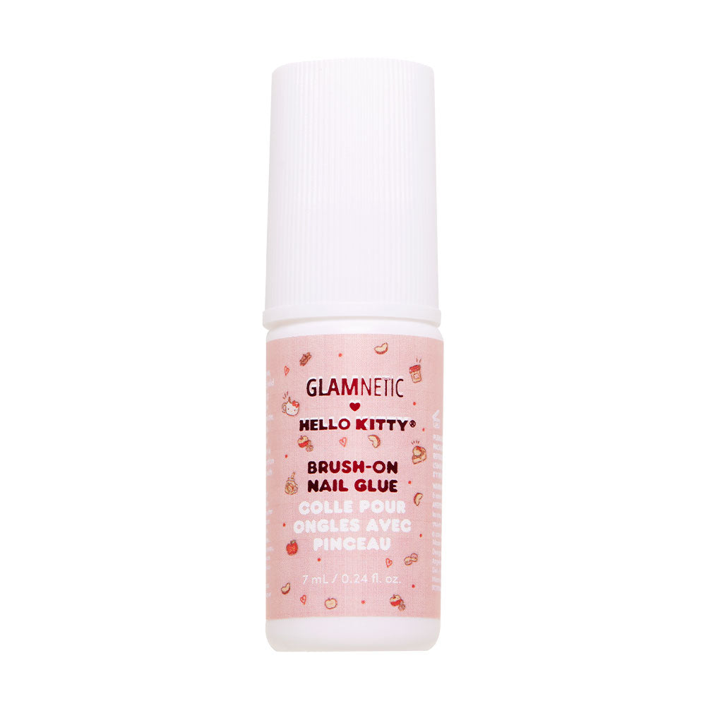 A small glamnetic Hello Kitty™ Brush-On Nail Glue bottle with a white cap and pink label featuring Hello Kitty icons—ideal for at-home manicures, with English and French text.