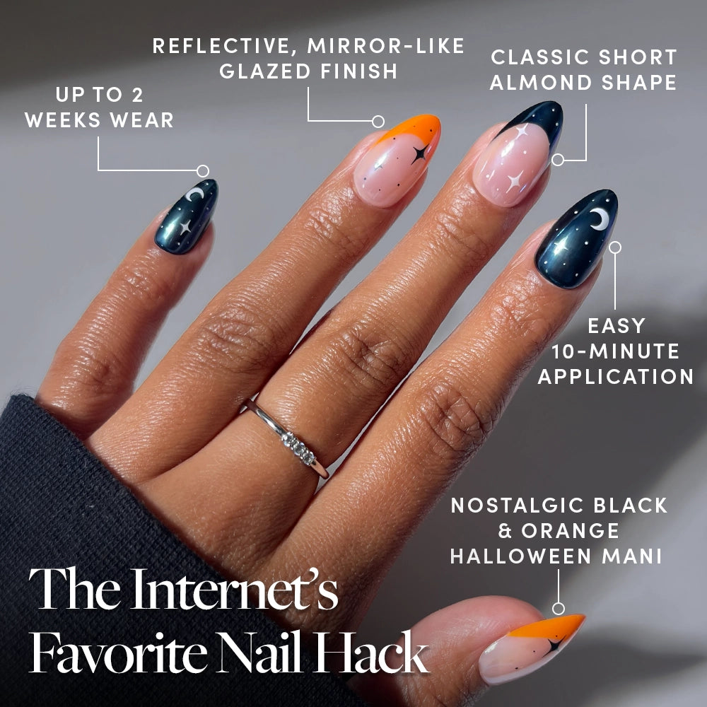 A hand with short, almond-shaped “October Nights” press-on nails by glamnetic, shown in black and orange Halloween designs with stars and moons. Callouts feature a glazed finish inspired by glazed French tips, a quick 10-minute application with easy press-ons, and up to 2 weeks of wear. Text reads: The Internet’s Favorite Nail Hack. - Product image