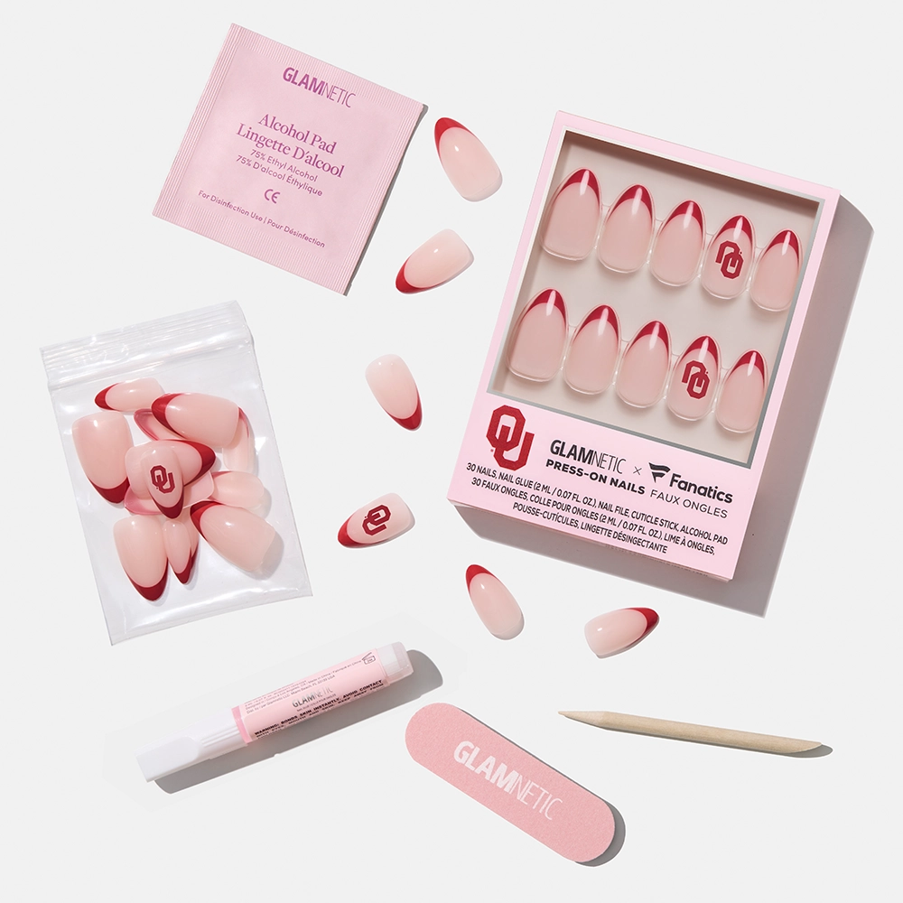 The glamnetic Oklahoma Sooners Press-On Nail Set includes salon-quality, officially licensed nails featuring the team logo, a nail file, cuticle stick, alcohol pad, glue, and extra nails—all displayed on a white background. - Product image