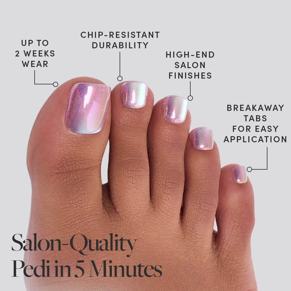 A close-up of a foot wearing glamnetic Oyster Toenail press-ons with a pearlescent, iridescent finish. Offers salon-quality pedi in 5 minutes, up to 2 weeks wear, chip-resistant durability, high-end finishes, and breakaway tabs. - Product image