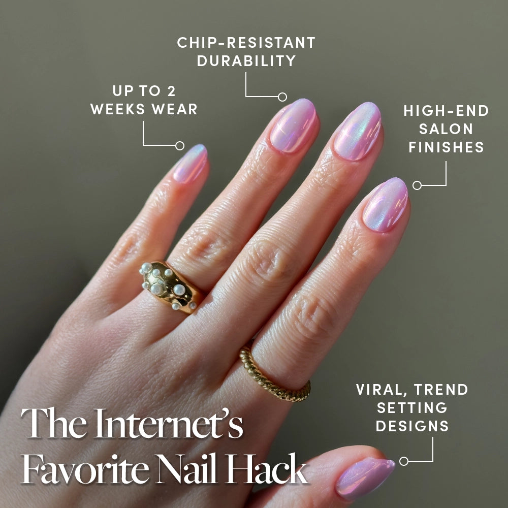 A hand with shiny, iridescent pink and pearlescent purple glamnetic Oyster nails wears two gold rings. Labels highlight chip-resistant durability, up to 2 weeks’ wear, salon-quality finish, and trend-setting design. - Product image