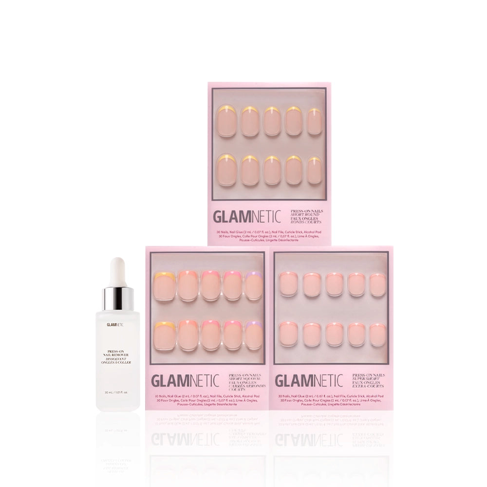 Three boxes of glamnetic Pardon My Pastels press-on nails, featuring pink and yellow pastel French tips, are arranged in a triangle with a white nail serum dropper bottle in front on a white background. - Product image