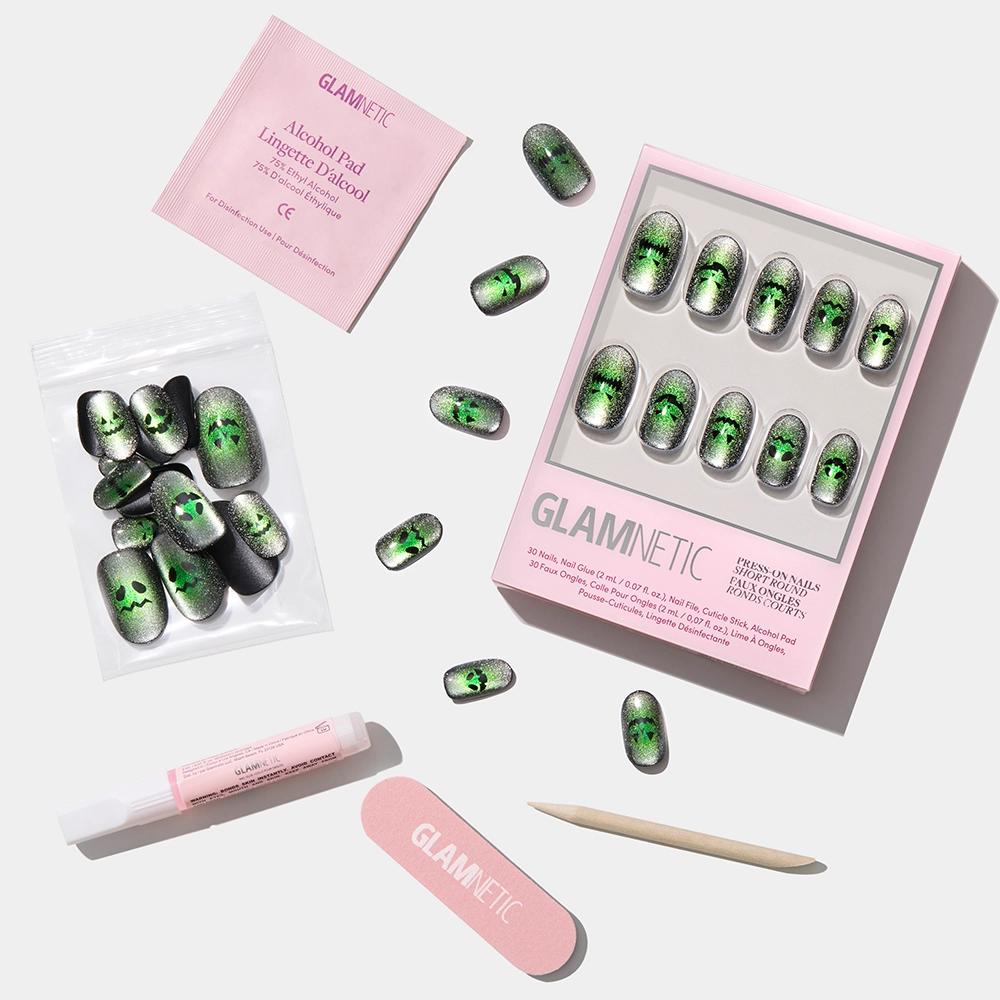 The glamnetic Peek-o’-Lantern set features short round nails in a green velvet shimmer gradient, plus an alcohol pad, nail file, cuticle stick, nail glue & extra nails—everything needed for a reusable manicure on white background. - Product image