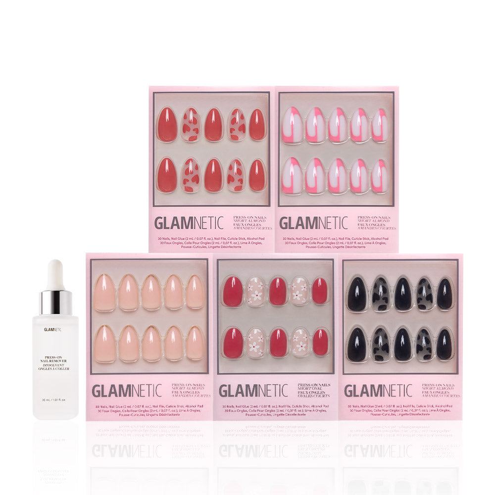 Six sets of glamnetic’s Perfect Match short almond press-on nails in vibrant designs come boxed in pink packaging, displayed with a dropper bottle of glue or serum on the left. - Product image