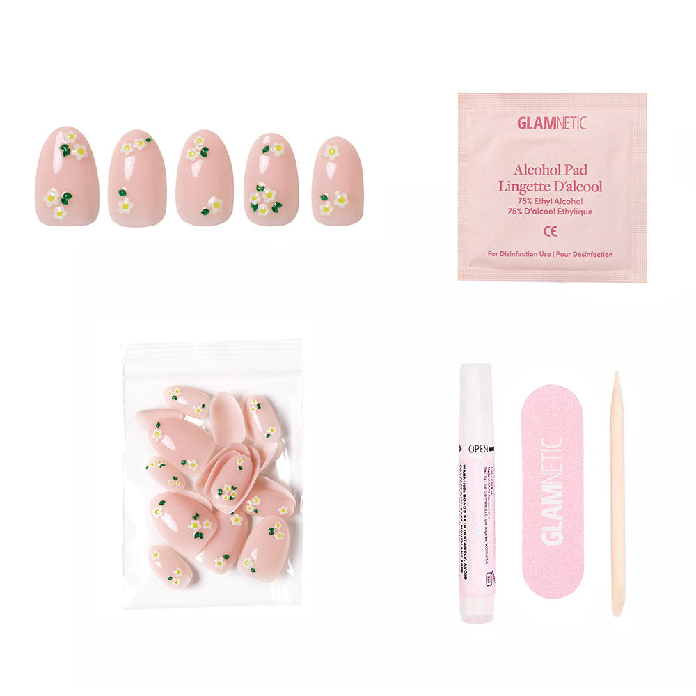 Petals by glamnetic: Pink short oval nails with white daisy accents and glossy finish. Includes alcohol pad, nail glue, pink file, and cuticle stick. - Product image