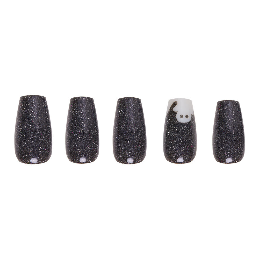 Five black, glittery, glow-in-the-dark press-on nails from glamnetic’s Phantom Glow set are displayed in a trendy coffin shape; the fourth nail highlights an adorable white animal face with charming ears and eyes at the top. - Product image