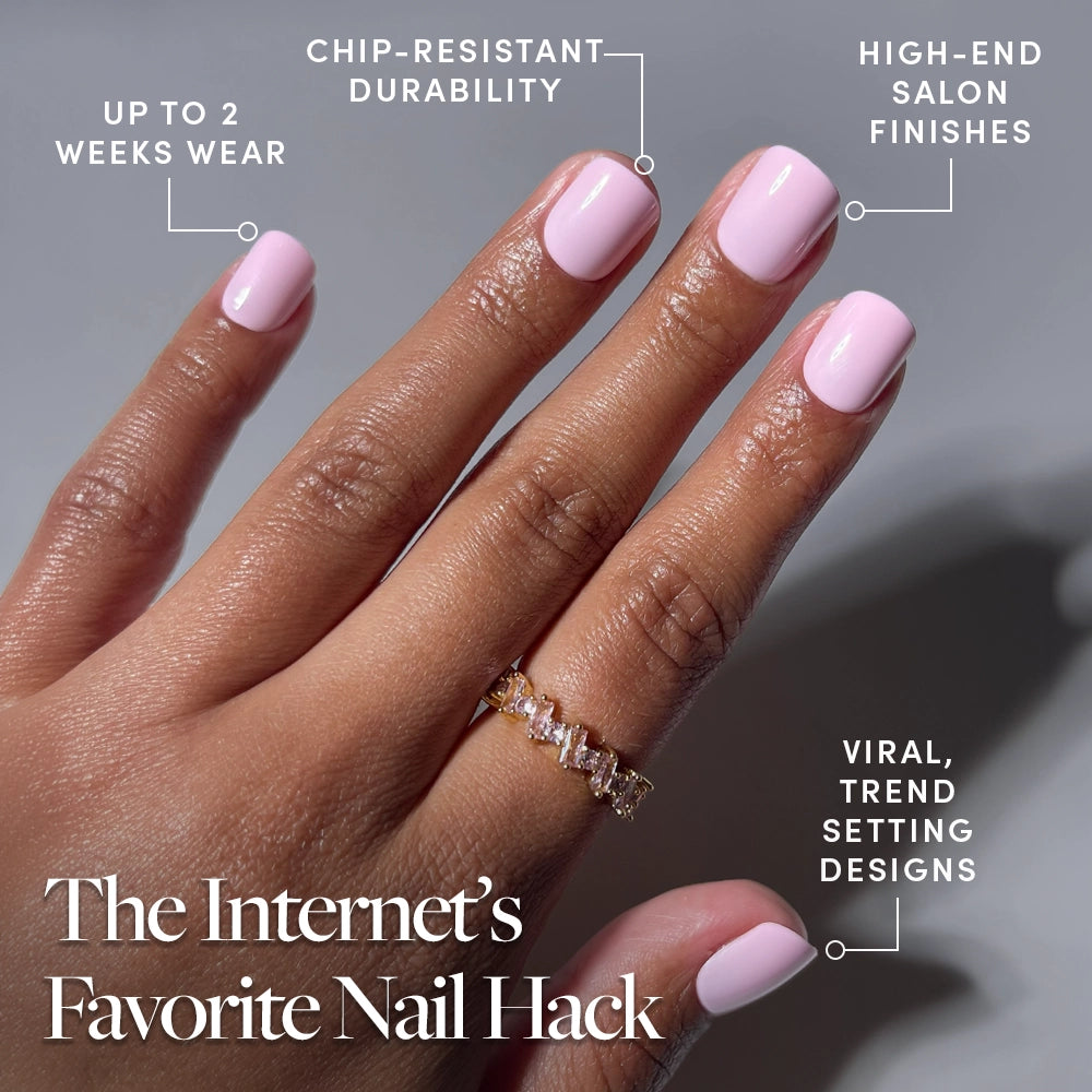 A hand with light pink, glossy glamnetic Pink Pop press-on nails is shown wearing a gold ring with square stones. Text highlights chip-resistant durability, high-end salon finish, up to 2 weeks wear, and trendsetting designs. - Product image