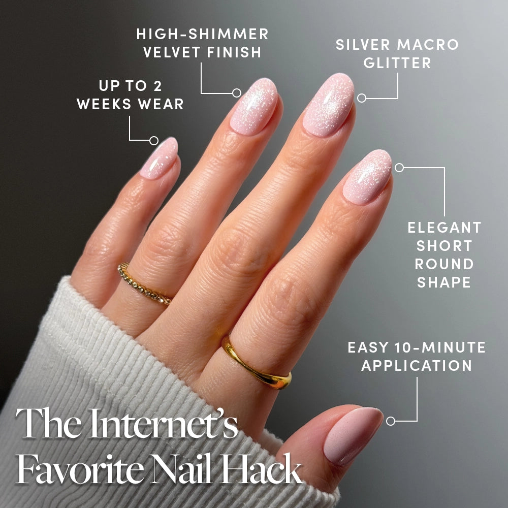 A hand shows glossy, light pink manicured nails. Text highlights glamnetic’s Pink Whisper short round press-ons: up to 2 weeks wear, chip-resistant, salon-quality finish, and trending designs. The Internet’s Favorite Nail Hack. - Product image
