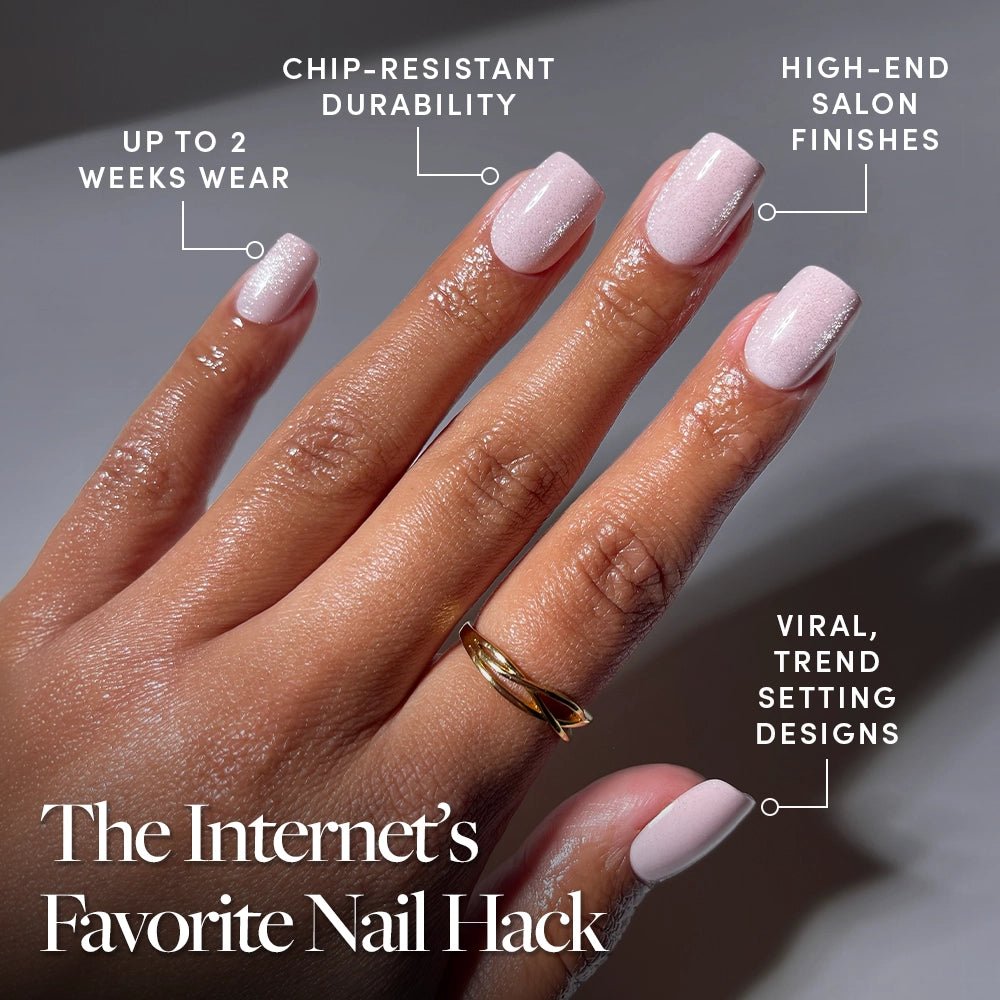 A hand with glossy, light pink "Pinky Promise" velvet press-on nails by glamnetic is shown, featuring chip-resistant durability, salon-quality finish, up to 2 weeks wear, and viral trend-setting style. Text: The Internet’s Favorite Nail Hack. - Product image