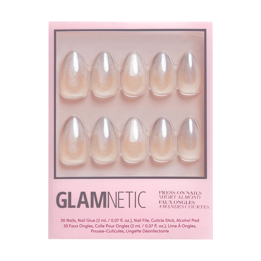 A box of glamnetic Polar Night almond nails in a short, shimmery nude-pink with a glossy velvet finish. Pink packaging shows product details at the bottom, displaying 30 nails from the set inside. - Product image