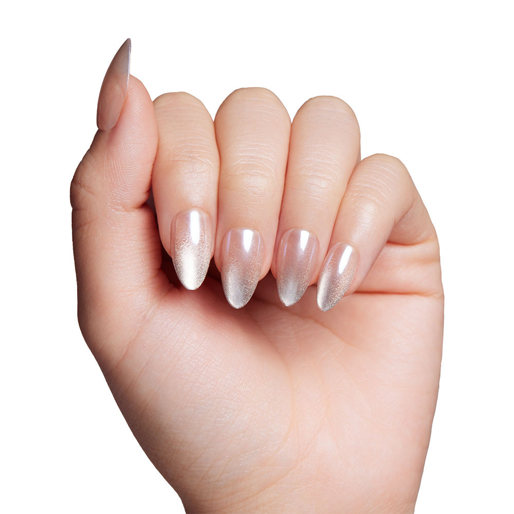 A hand with long, almond nails painted in glamnetics Polar Night—an iridescent white polish with a glossy velvet finish—displayed against a plain white background. - Product image