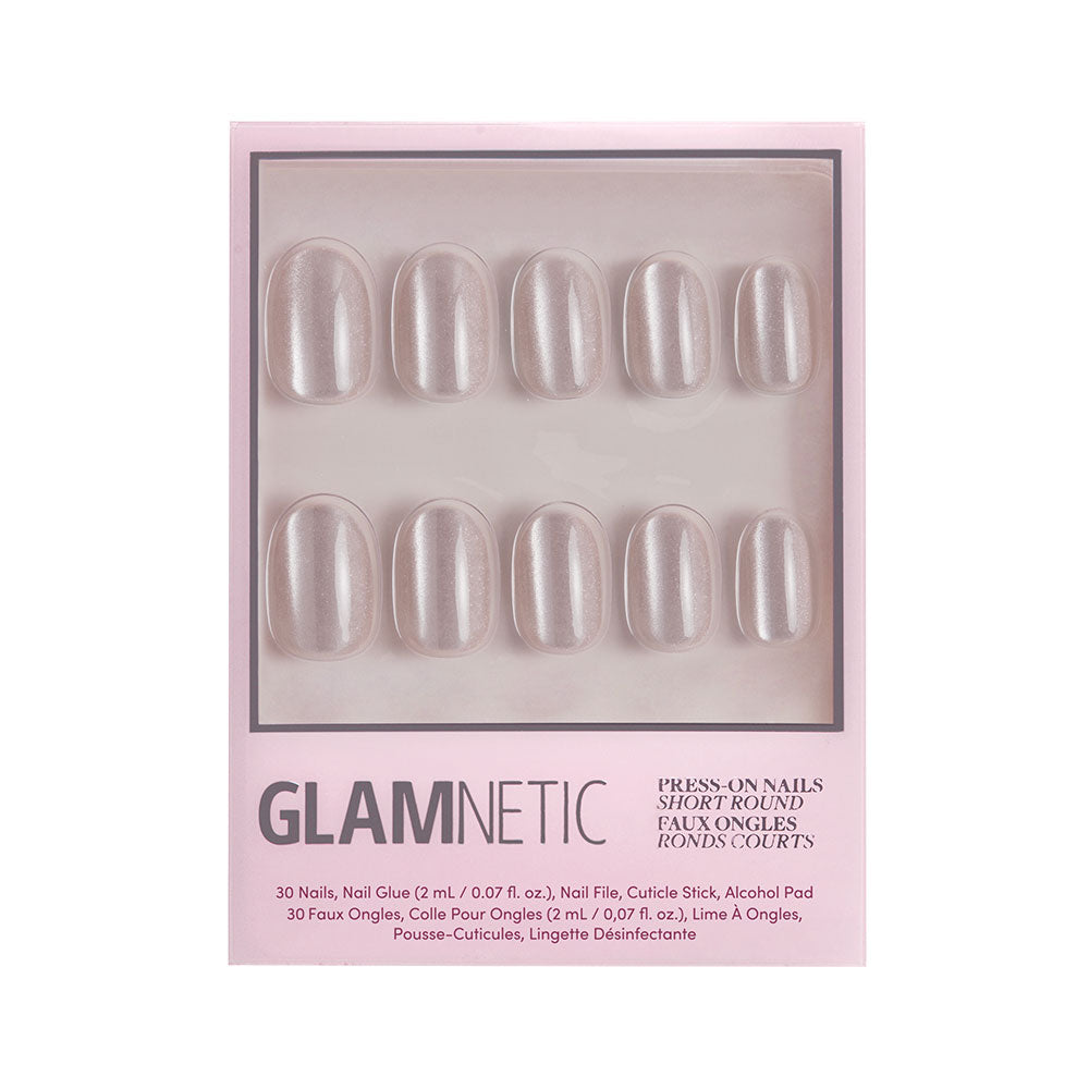A box of glamnetic Pure Intentions nail set in a short round shape with a pearly iridescent hue. The pink box displays 10 nails through a clear window and features black and silver text.