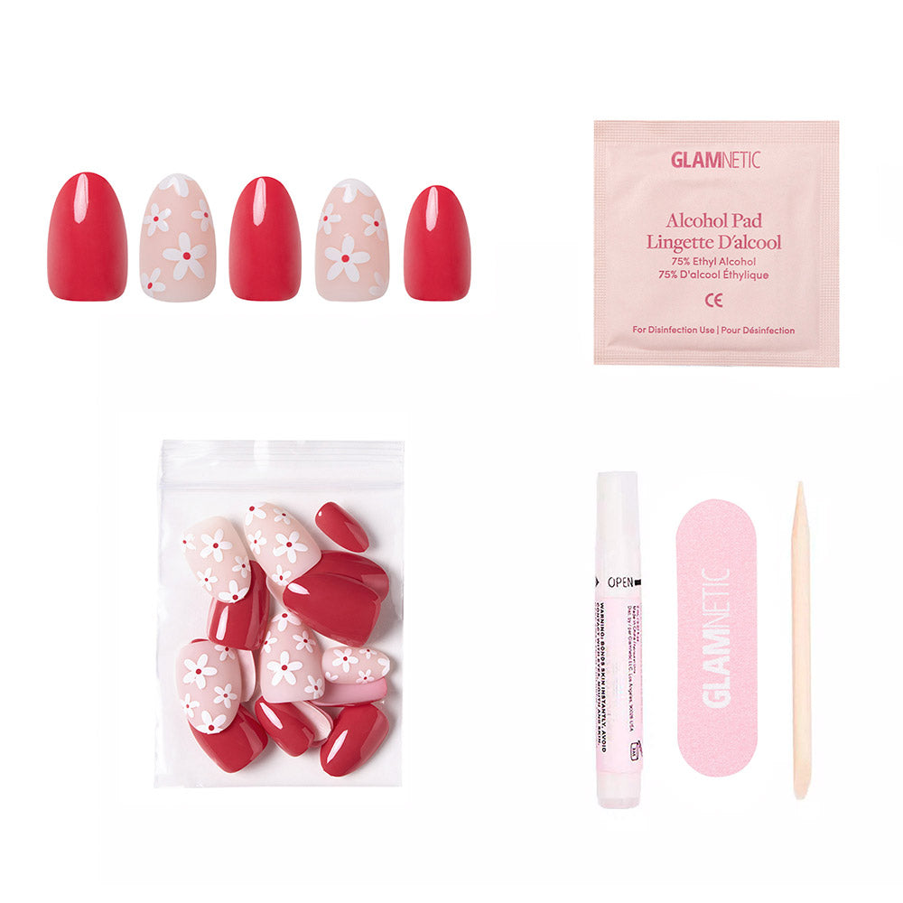 The glamnetic Red Blossom press-on nail kit includes glossy red blossom nails, pink floral accent nails, an alcohol pad, file, cuticle stick, glue, and a bag with extra floral-patterned nails. - Product image
