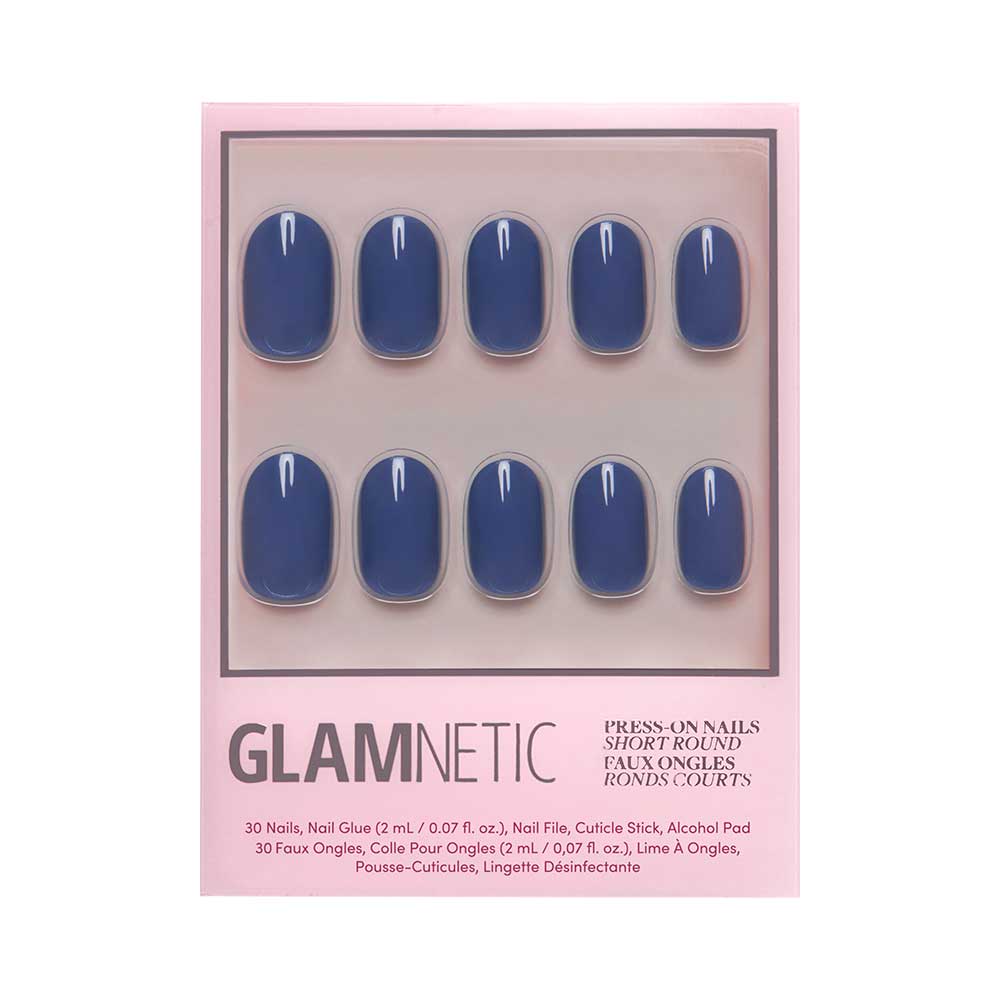 A box of Glamnetic Regal Blue press-on nails in a short, rounded shape with a glossy finish. Comes in pink packaging with nail glue, file, cuticle stick, and alcohol pad. All nails are vegan and cruelty-free. - Product image