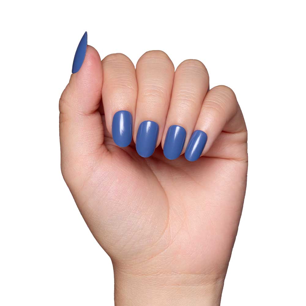 A hand with neatly manicured nails painted in Regal Blue nail polish, showcasing a glossy finish, is displayed against a plain white background. - Product image