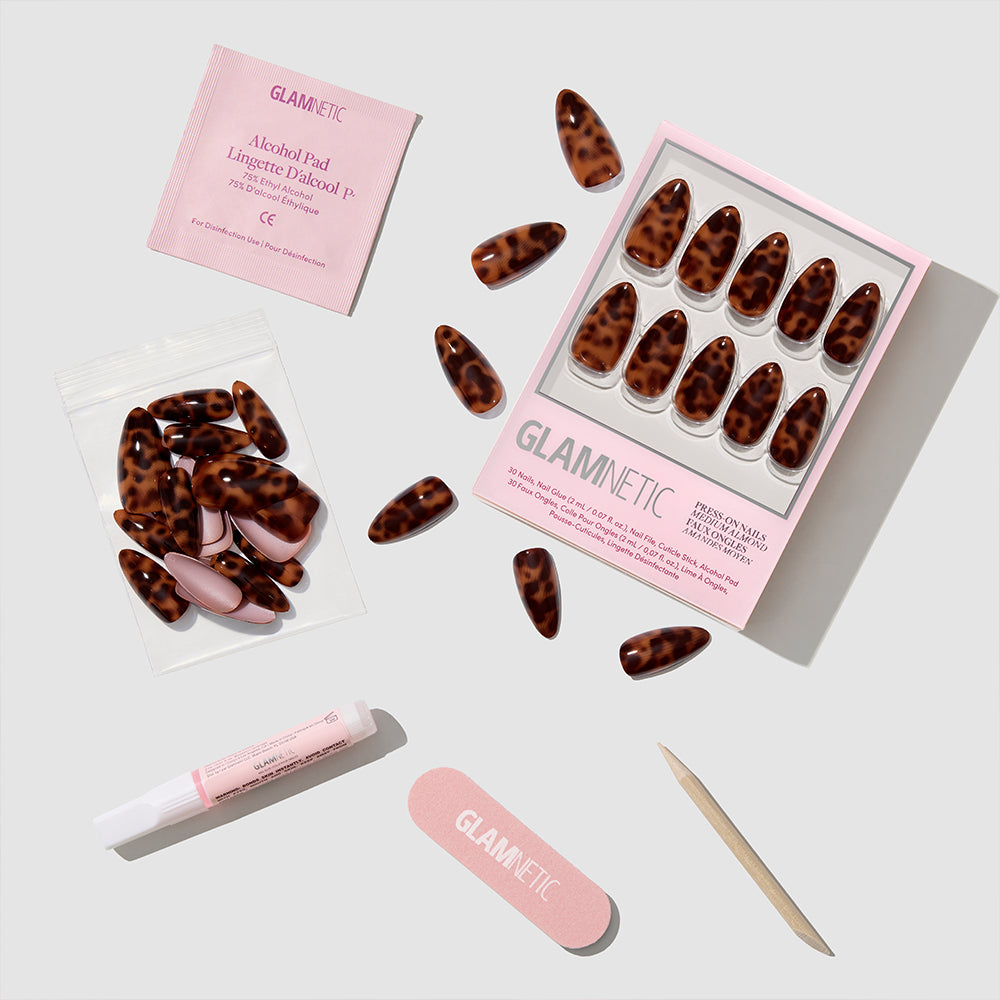 Glamnetic’s Rich Behavior features chic almond-shaped tortoiseshell press-on nails, complete with an alcohol pad, nail glue, nail file, cuticle stick, and extra nails—everything needed for a salon-quality manicure at home. - Product image
