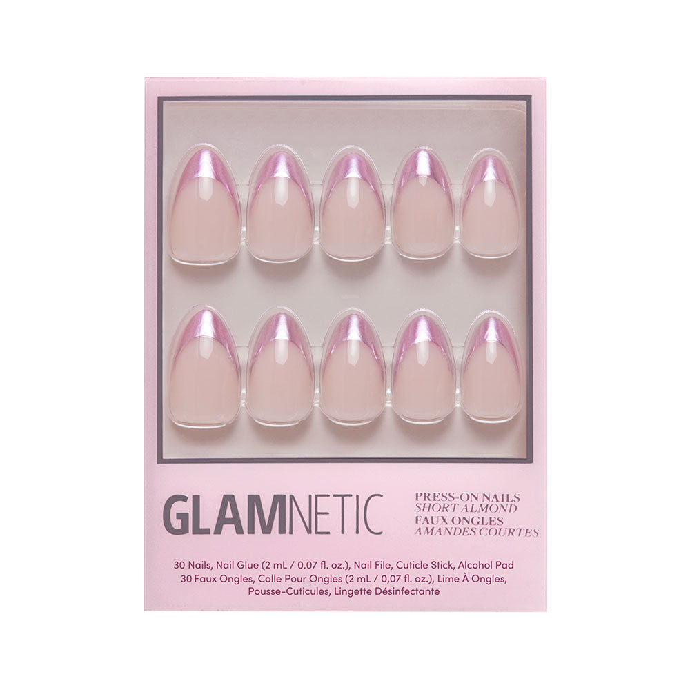The glamnetic Rock Candy press-on nail set features short almond nude nails with chrome rose gold French tips. Each box includes ten nails, nail glue, a file, cuticle stick, and alcohol pad.