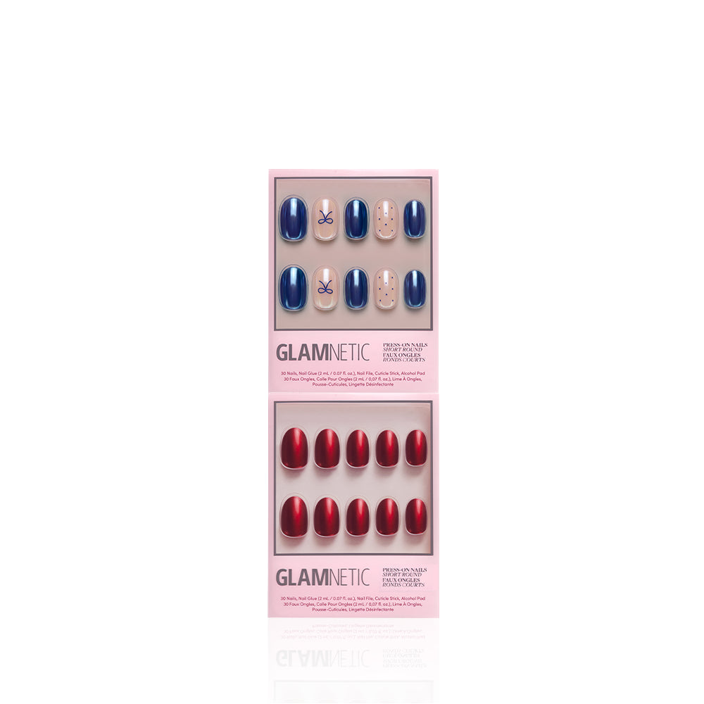 Round the Tree - Two sets of Glamnetic Round the Tree press-on nails: the top set is navy blue with small bow accents, and the bottom set is metallic red.