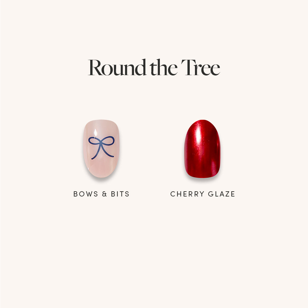 Round the Tree - Two short, round, salon-quality Round the Tree press-on nails: one light pink with a blue line-art bow design, and one solid metallic red.