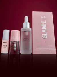 Glamnetic nail care products including a bottle, a box, and small containers on a red background