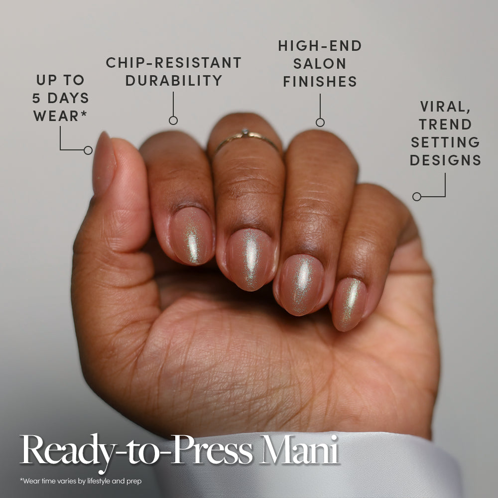 A hand displays glamnetic’s Sparkly Brown metallic, shimmery press-on nails. Enjoy up to 5 days wear, chip-resistant durability, salon-quality shine, on-trend designs, and easy application—no glue needed. - Product image