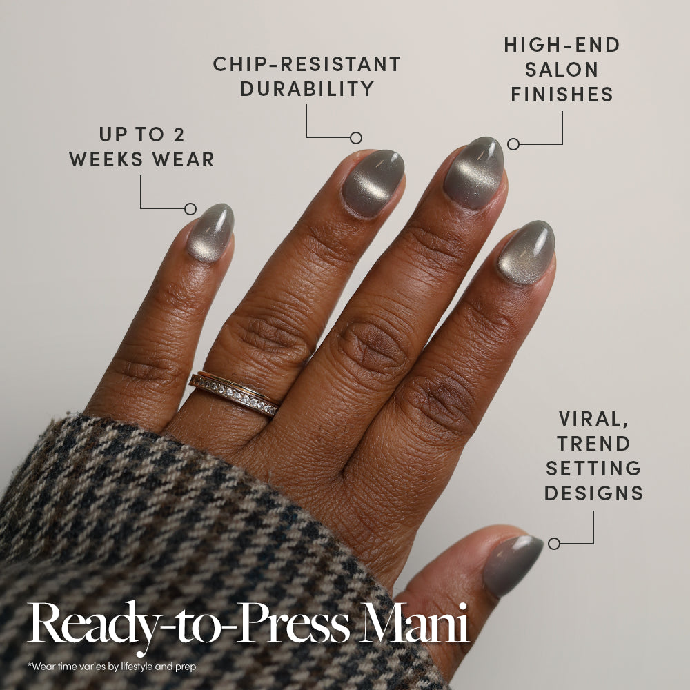 A hand with short, sparkly moss green press-on nails by glamnetic is shown, featuring up to 2 weeks wear, chip-resistant durability, salon-quality shine, and trendy designs. Text reads: Ready-to-Press Mani—no glue needed for flawless nails in minutes. - Product image