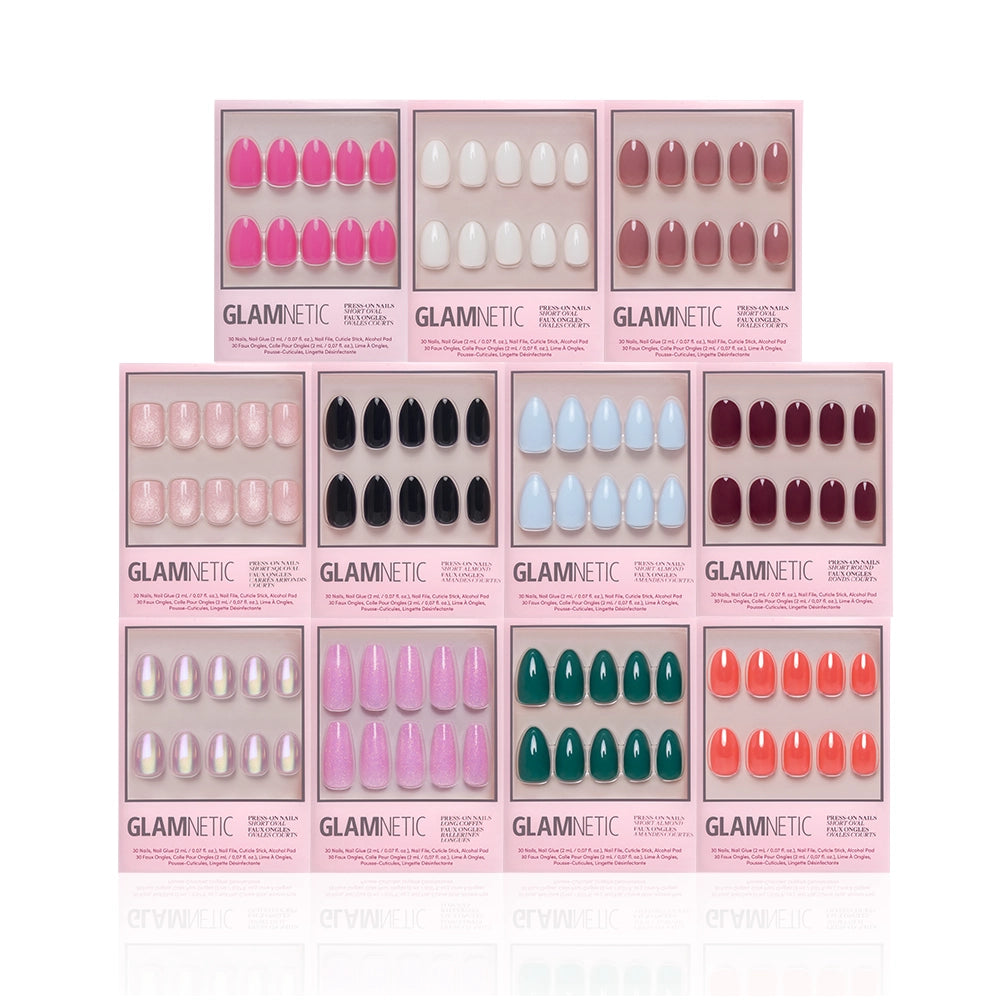 The Sole Mates Mani Bundle by glamnetic features ten press-on nail sets in pink, white, nude, black, blue, red, green, and iridescent shades—arranged in two rows on a white background for a vibrant display. - Product image