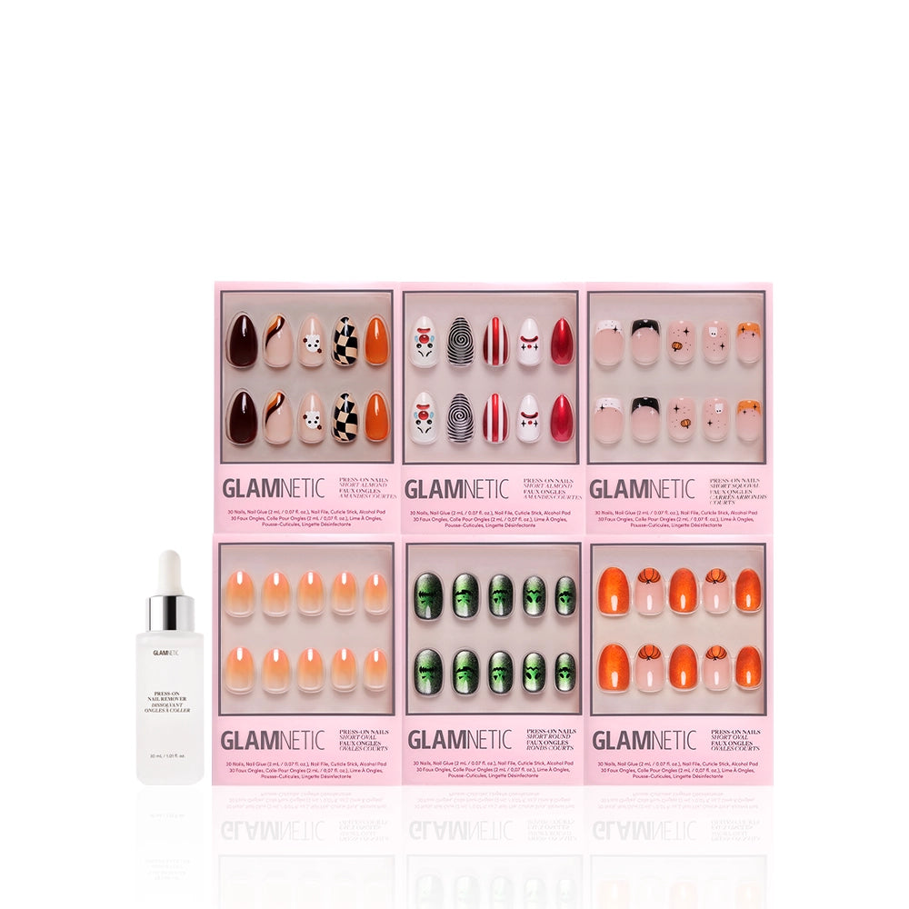 Five sets of Glamnetic Scream Chic press-on Halloween nails, including pumpkin and autumn designs, are displayed in pink boxes with a nail glue dropper bottle, all arranged on a white background. - Product image