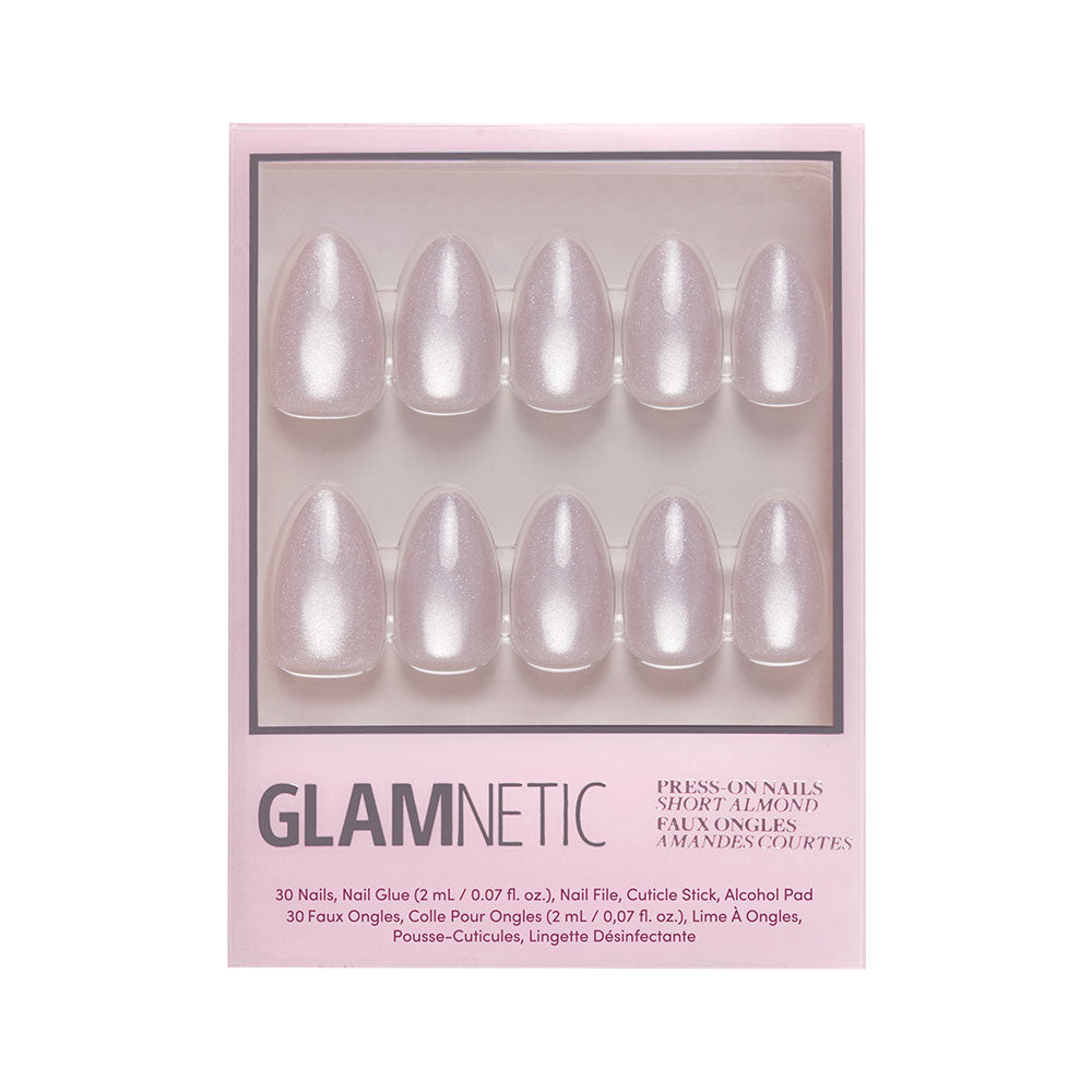 A box of glamnetic Selenite short almond press-on nails in pearly light pink with a velvet finish. Includes 10 nails plus nail glue, file, cuticle stick, and alcohol pad. - Product image