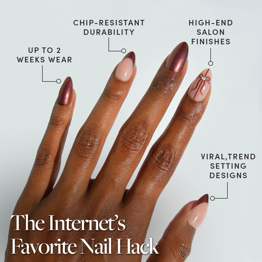 A hand showcases glamnetic’s “She’s A Gift”—long, almond-shaped press-on nails featuring glossy brown and nude designs. Benefits highlighted in text: up to 2 weeks wear, chip-resistant, high-end finish, viral styles. White text reads: The Internet’s Favorite Nail Hack. The perfect chic nude nail set for effortlessly elegant almond nails. - Product image