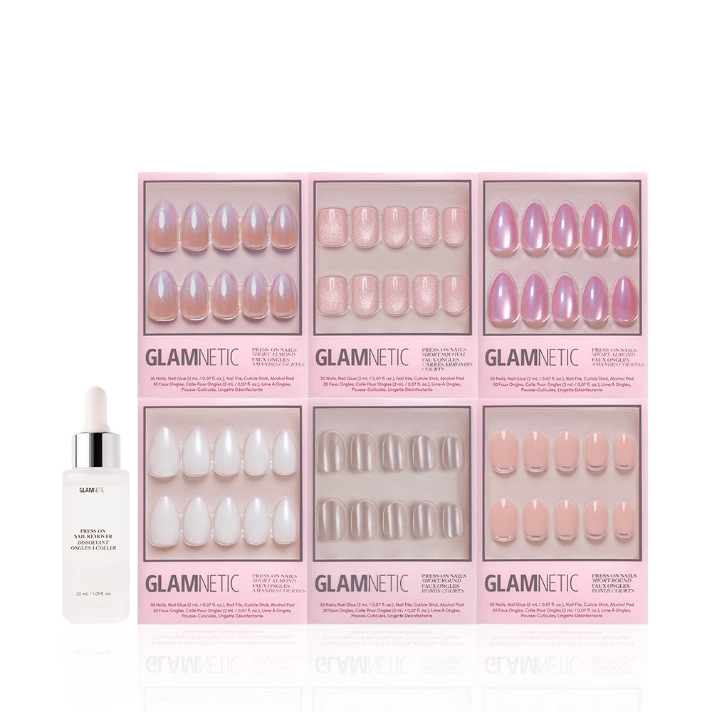 Six boxes from the glamnetic Shimmer Soiree Bundle in soft glam shades of pink, nude, and white are arranged in two rows, with a dropper bottle of GLAMNETIC Press-On Nail Remover Serum placed in front. - Product image